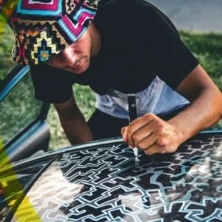 TAYLINES drawing maze lines on a car hood